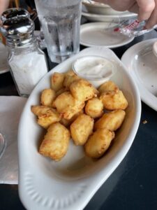 A scenic river with a biblical verse from Isaiah 43:2-3 about God's protection and redemption.