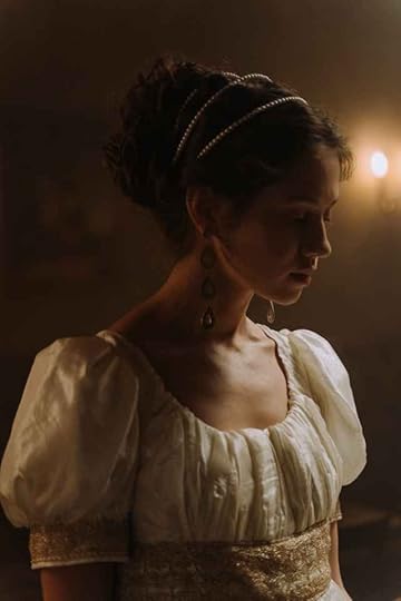 Current image: young woman in a costume of an aristocrat wearing a white dress