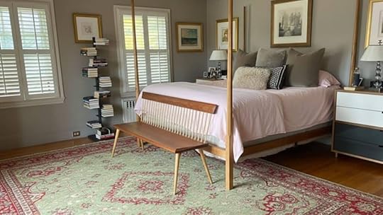 only the foot of the bed on the rug