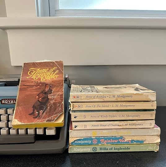 Anne books displayed near a typewriter