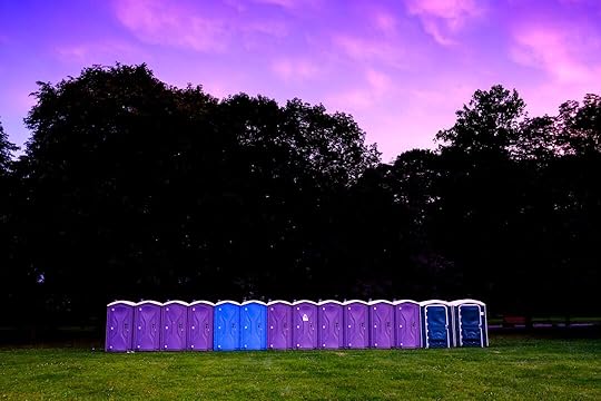 photography of portable toilet on field
