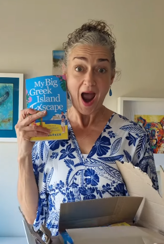 Me holding the book excited