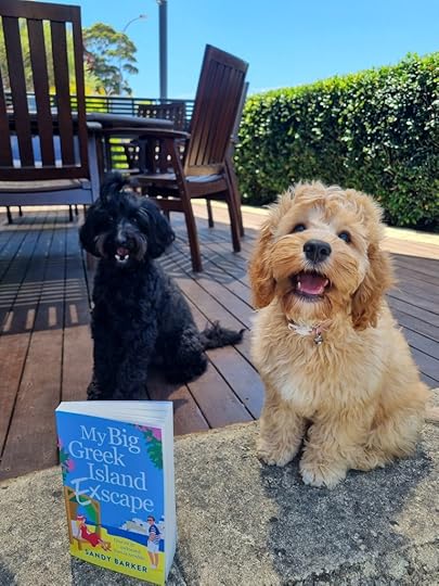 2 dogs with the book 