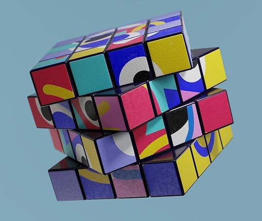 a multicolored cube is flying in the sky