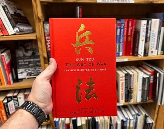 Nick holding red copy of 