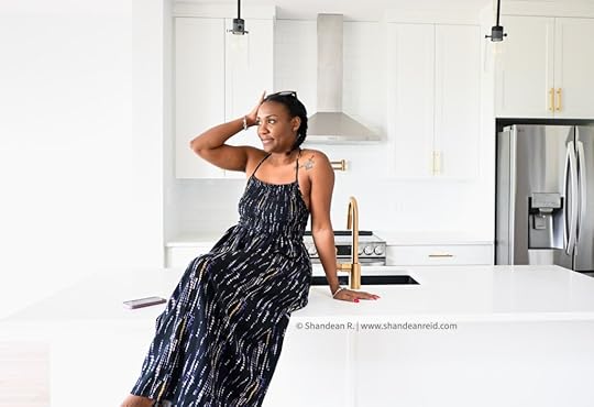 Home and family blogger Shandesn Reid sitting on empty counter in new house on Buying a Home in Canada: 5 Things I Learned blogpost
