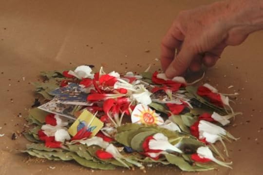 hand adding an item to a group of items as part of a ritual