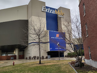 Image of the exterior of an arena, with the words ExtraMile Arena on the upper level.