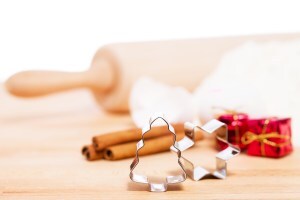 Rolling pin, cookie cutters and cinnamon sticks for baking.