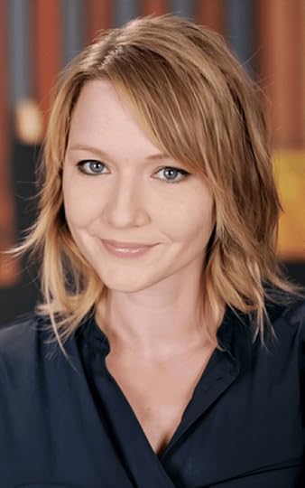 Michelle M. Pillow headshot with bookshelf background, NYT bestselling romantasy author