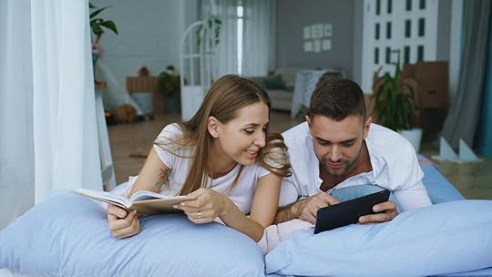 Couple reading together in bed