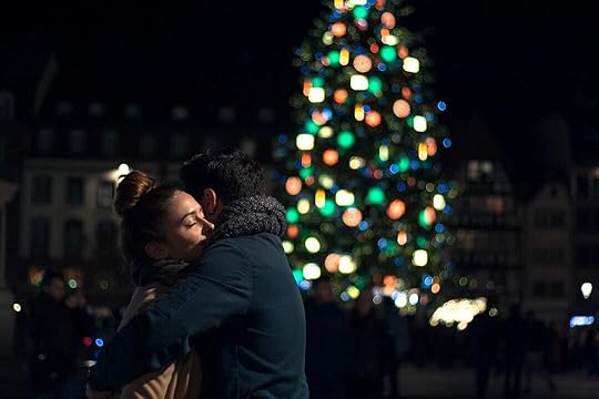 selective focus photography of man and woman hugging each other near Christmas tree