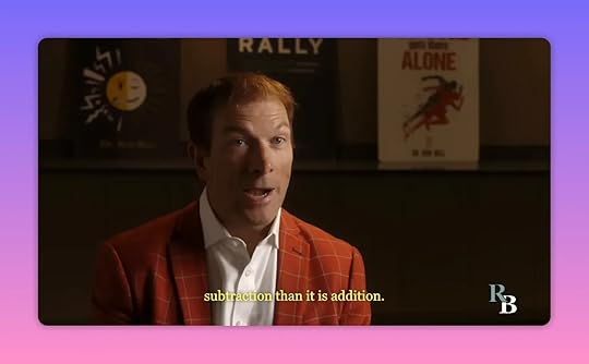 Interview-style shot of a speaker in a checked jacket talking about mental strategies.