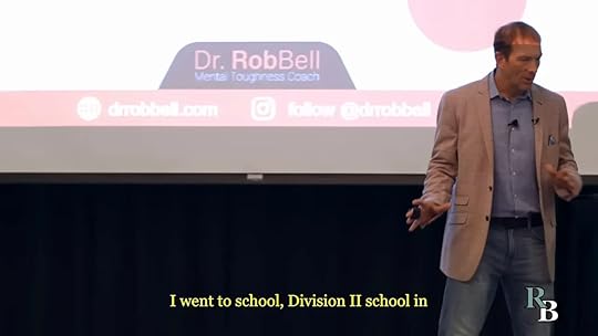 Keynote speaker Dr. Rob Bell onstage presenting a mental toughness talk