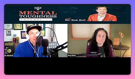 Split-screen podcast interview showing host at a microphone and guest in a home office with visible lamp and book, clear lighting and composition