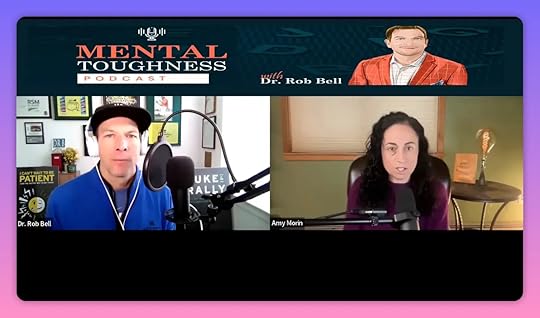 High-quality podcast screenshot of Amy Morin and host Dr. Rob Bell with visible lamp and book highlighting the idea of environmental design