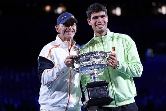Spain's Carlos Alcaraz celebrates with his coach Samuel Lopez after defeating Serbia's Novak Djokovic in the men's singles final on Day 15 of the...