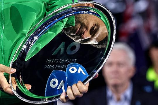 Serbia's Novak Djokovic looks at the runner-up shield following his defeat to Spain's Carlos Alcaraz in the men's singles final on Day 15 of the...