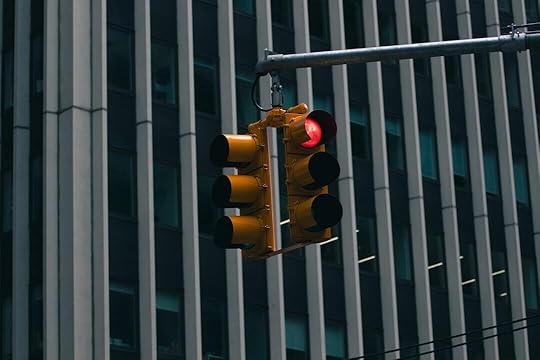a traffic light hanging from a metal pole