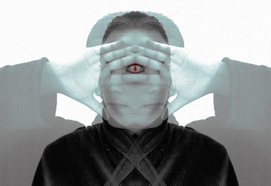 Surreal mirrored image of a person covering their face with hands, revealing a symbolic third eye at the center to represent third eye chakra opening symptoms.
