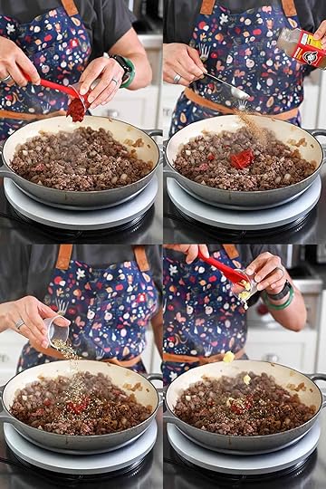 Four sequential photos that show someone in a blue apron seasoning cooked ground beef and diced onions in a gray skillet with tomato paste, Magic Mushroom Powder, Italian seasoning, and minced garlic.
