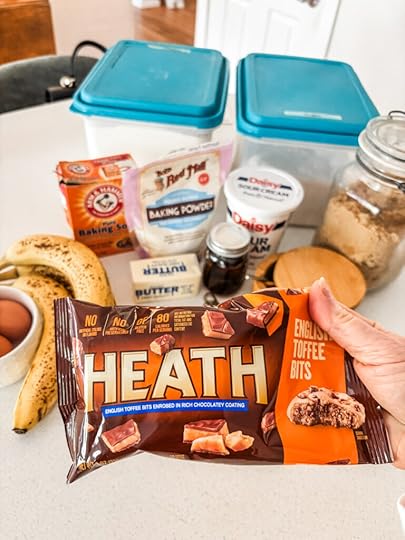 The ingredients for the banoffee cake, with the bag of heath pieces being held up