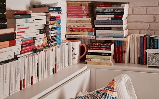 a corner with a full bookshelf