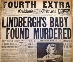 Historic newspaper headline reporting on the murder of Lindbergh's baby, featuring large bold text and an image of the child beneath.