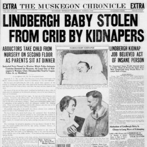 Front page of 'The Muskegon Chronicle' newspaper reporting on the kidnapping of the Lindbergh baby, featuring bold headlines and a photograph of the parents.