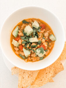 The bowl of chili with toppings and chips