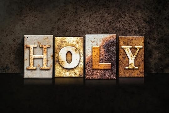 The word holy in on vintage letter blocks