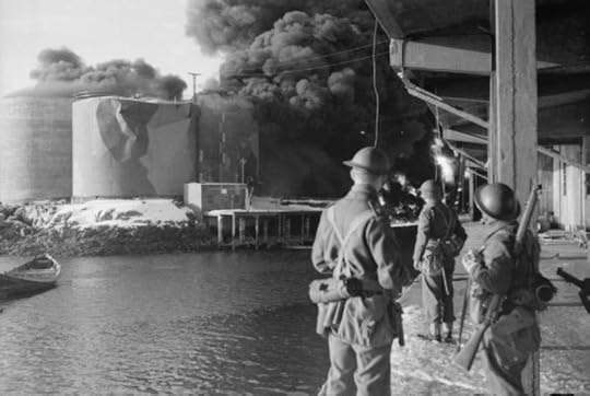 Raid on the Lofoten Islands: British Commandos watching fish oil tanks burning, 4 March 1941 (Imperial War Museum: N 396)