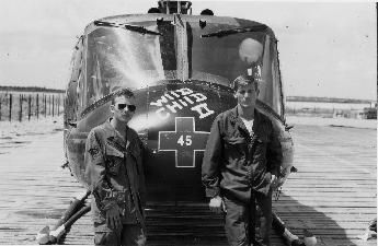 This may contain: two men standing next to an airplane on a wooden platform with the pilot in front of it