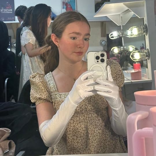 A selfie of a young woman in a Regency gown
