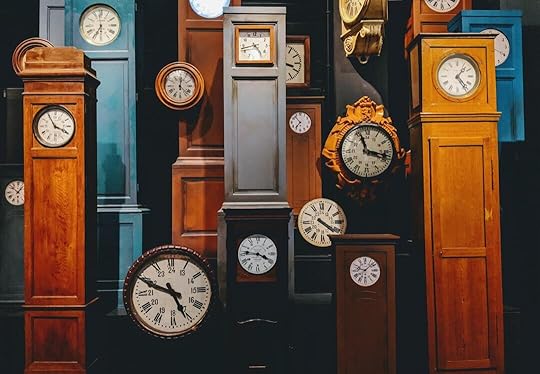 brown wooden framed analog clock