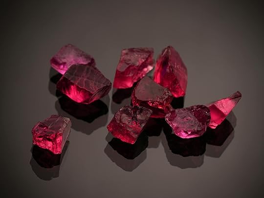 red gemstones on a black surface