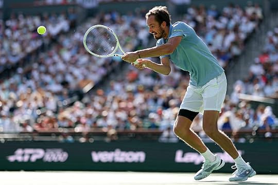 Daniil Medvedev returns against Jannik Sinner of Italy during their Men's Singles Finals match on Day 12 of the BNP Paribas Open at Indian Wells...