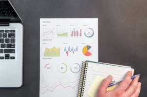 stock image of charts and notebook