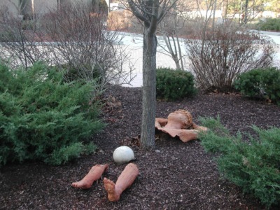 Mulched tree with ground sculpture