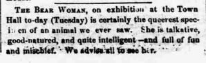 Text from an old newspaper advertisement promoting 'The Bear Woman' exhibit at the Town Hall, describing her as a unique, intelligent, and entertaining character.