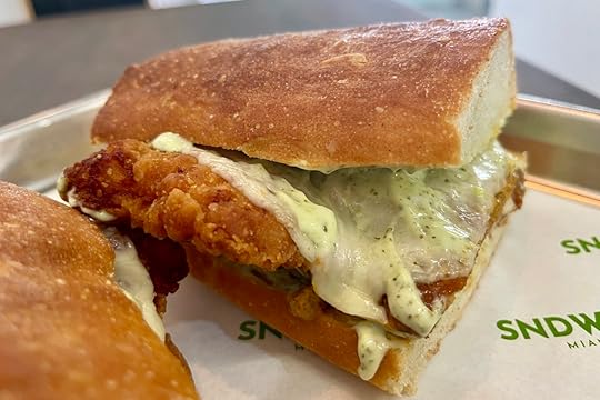 Chicken Parm sandwich from SNDWCH with crispy chicken, mozzarella, vodka sauce, pesto mayo, and focaccia