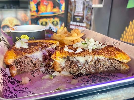 Birria grilled cheese sandwich from Talkin' Tacos in Miami Springs with melted cheese and chopped onions