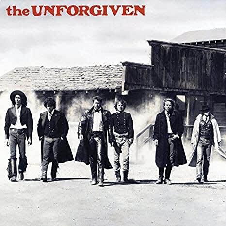 Album cover for The Unforgiven's 1986 self-titled debut on Elektra Records. Six band members walk down a dusty street in long coats and Western attire.