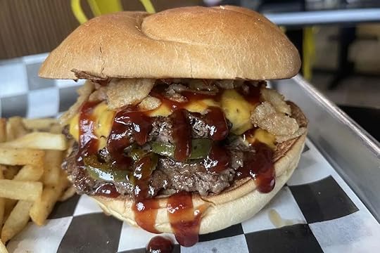 Island Smash Burger from Between Two Buns in Kendall, Florida, featuring double smash patties, roasted pineapple, roasted jalapeño, cheese, BBQ sauce, and fried onions.