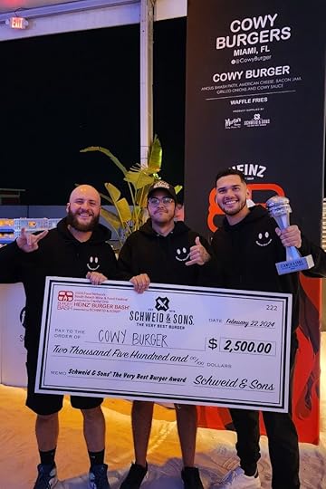 Cowy Burger team holding the Judge’s Choice Award check at the South Beach Wine & Food Festival Burger Bash