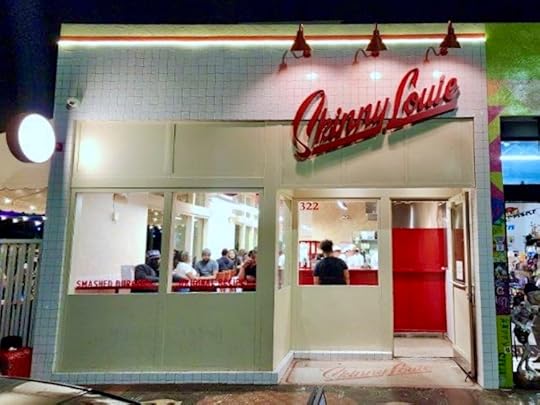 Skinny Louie’s restaurant exterior in Wynwood Miami at night