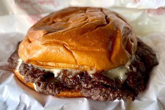 Truffle Wagyu Burger from Smash Bros Burgers and Shakes in Miami with American cheese and caramelized onions
