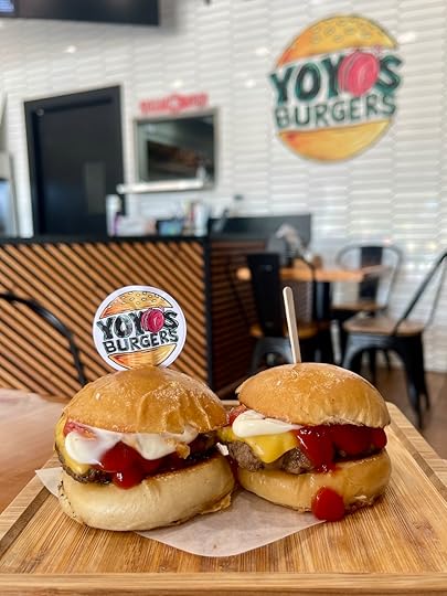 YoYo’s Burgers sliders served on toasted buns with cheese and sauce