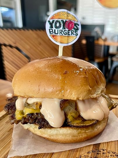 Smash burger from YoYo’s Burgers with melted cheese and grilled toppings