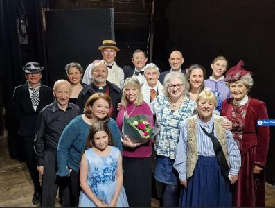 cast photo on stage after show
